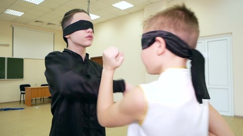 Chelyabinsk, Chelyabinsk region, Russia - 02.06.2022: Guys show a blind fight.

Young athletes are very good at practicing blind fight. Sharp and smooth movements of the arms and body.