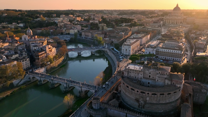 Aerial view of Castel Sant'Angelo and San Pietro in Rome. Tiber river, its bridges and St. Peter's, Vatican City at sunset. City centre of Roma, Italy in the evening. High quality 4k footage Royalty-Free Stock Footage #1089317265