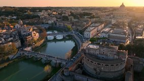 Aerial view of Castel Sant'Angelo and San Pietro in Rome. Tiber river, its bridges and St. Peter's, Vatican City at sunset. City centre of Roma, Italy in the evening. High quality 4k footage