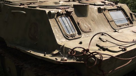 Padded armored personnel carrier. Old military padded Soviet transport. Russian combat vehicle, with holes in the armor. Disabled, blew up, destroyed.