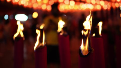 Select focus red incense joss stick burn at temple