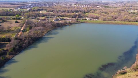 Aerial footage of small pond or lake in Anna Texas.