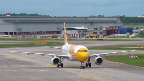 Singapore , Singapore - 04 10 2022: Scoot And Starlux Airlines At Changi Airport