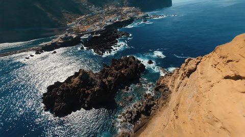 mountain and cliff in the middle of the sea, with large cliffs in DJI and FPV drone, presence of forest, grass, cloud and waterfall on the island of madeira in portugal. ஸ்டாக் வீடியோ