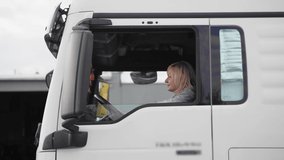 Caucasian mid age woman driving truck. trucker female worker, transport industry occupation  - Powered by Shutterstock - Get 15% off with code: PIKWIZARD15