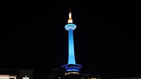 KYOTO, JAPAN - MARCH 23, 22: Nighttime illumination of Kyoto Tower. Tallest structure in Kyoto. High quality 4k footage.