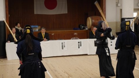 Tokyo, Japan - February 23, 22: Kendo practice in Dojo, Tokyo, Japan. Kendo warrior practicing martial art with the bamboo bokken. High quality 4k footage