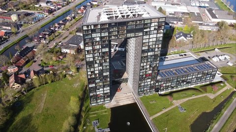 GRONINGEN, NETHERLANDS - 16. APRIL 2022: Fast orbiting Aerial view of Tasman Tower, modern apartment comlex in Groningen.