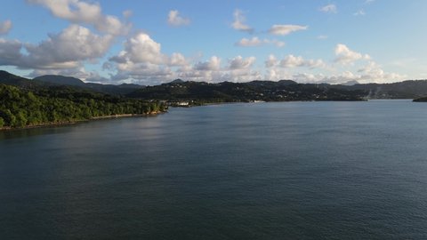 Areal view of rainforest mountains paradise along beaches at sunset. Near the cities of Choc and Corinth in Saint-Lucia - Drone, 