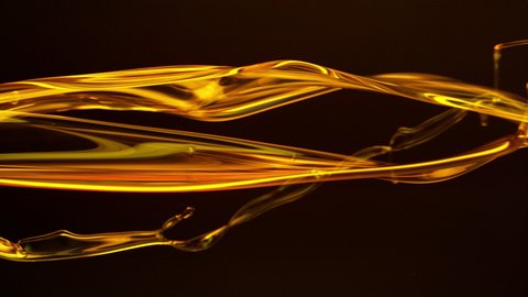 Super Slow Motion Shot of Flowing Oil on Black Background at 1000fps.