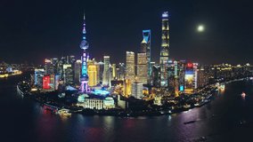 Aerial footage of modern commercial buildings and skyline in Shanghai at night, China. Famous city landmarks in China.