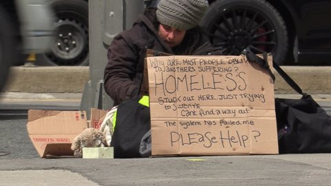 Toronto, Ontario, Canada April 2022 Unemployed homeless people surviving on Toronto streets in recession