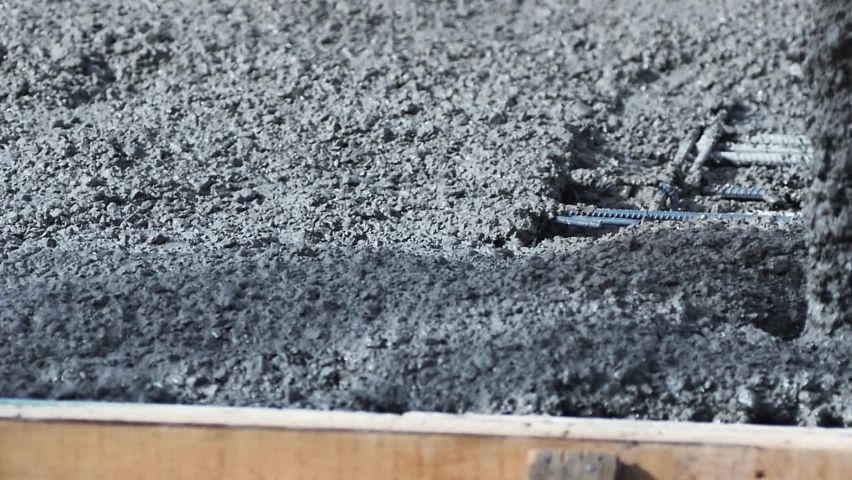 Slow Mo. Concrete mix being pouring on concreting formwork. Forming, an essential part of entire building process. Before concrete can be poured, forms need to be built to hold concrete in place
 Royalty-Free Stock Footage #1089352895