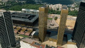 Aerial view of Court of Justice and Administrative Offices of European Union in Kirchberg quarter of Luxembourg City. Urban Cityscape of Downtown with Skyscrapers. 4K drone panoramic establishing shot - Powered by Shutterstock - Get 15% off with code: PIKWIZARD15