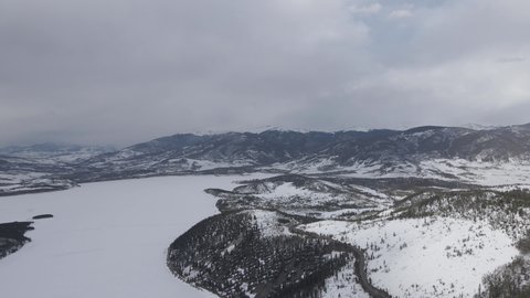 Lake Dillon, Colorado USA. Aerial View of Frozen Water Reservoir and White Cold Winter Landscape of Keystone Ski Resort
