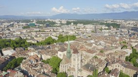 Inscription on video. Geneva, Switzerland. Flight over the city. Geneva Cathedral. Name is burning, Aerial View, Departure of the camera