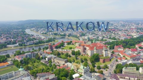 Inscription on video. Krakow, Poland. Wawel Castle. Ships on the Vistula River. View of the historic center. Blue lights form luminous. Electric style, Aerial View, Point of interest
