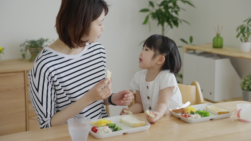 Asian family eating at home