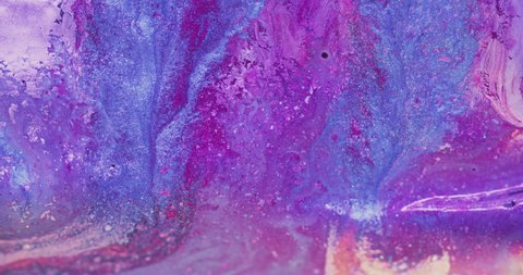 Paint mix. Wet ink texture. Marble pattern. Blur fluorescent purple pink blue color shiny fluid wave motion creative abstract background shot on RED Cinema camera.