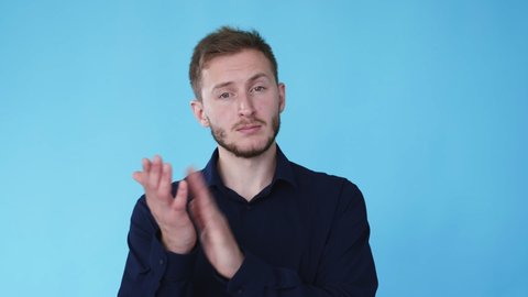 Skeptical man. Unimpressed expression. Negative attitude. Boomerang animation. Discontent guy clapping hands in sarcastic emotion isolated on blue background GIF loop motion.
