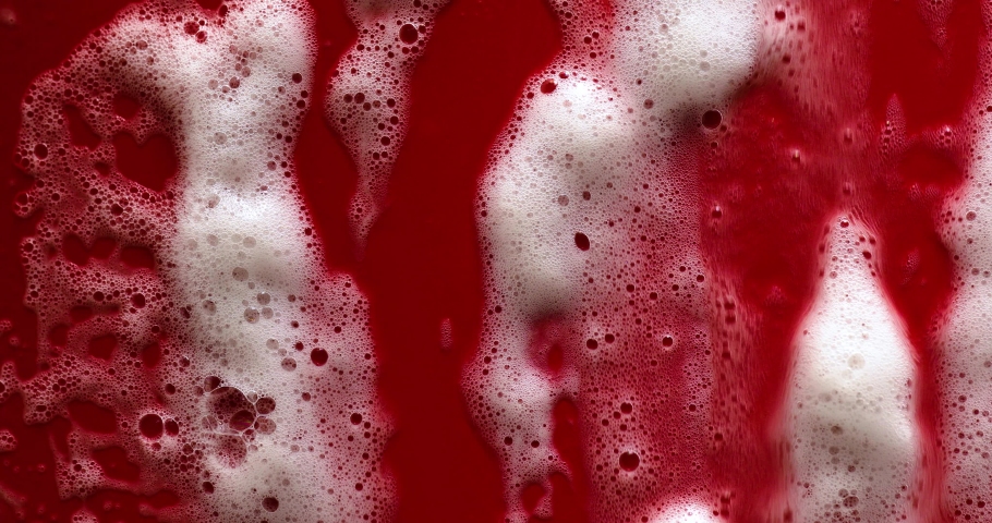 Texture of white soap foam with bubbles abstract red background, Soap, shower gel, shampoo, Face Cream cleansing mousse sample.
 Royalty-Free Stock Footage #1089370871