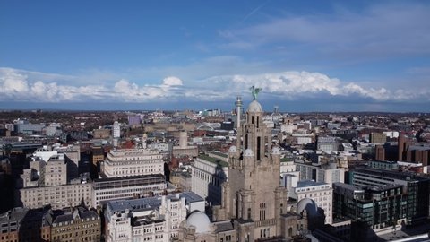 LIVERPOOL, UK - 2022: Aerial establishing view of the Royal Liver Building in Liverpool city UK