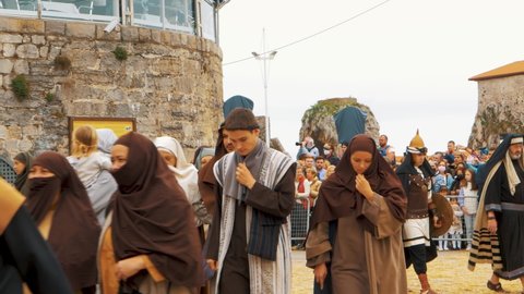 CASTRO URDIALES, Cantabria  SPAIN - APRIL 15, 2022: Video of Traditional Holy Week celebration in Spain with a real biblical representation of the Jesus Christ crucifixion on Good Friday