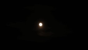 Beautiful evening or night landscape with moon light. 4k video time lapse of bright full moon cirlce rising up in clear dark blue evening sky background