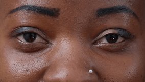 Macro shot montage of authentic people showing eyes and mouth in front of camera, feeling confident about natural look. Humans with candid smiles and white teeth blinking and feeling happy.