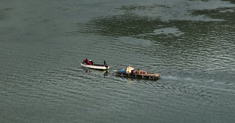 Aerial view. A small fishing boat carries cargo across the lagoon of the Indian Ocean
