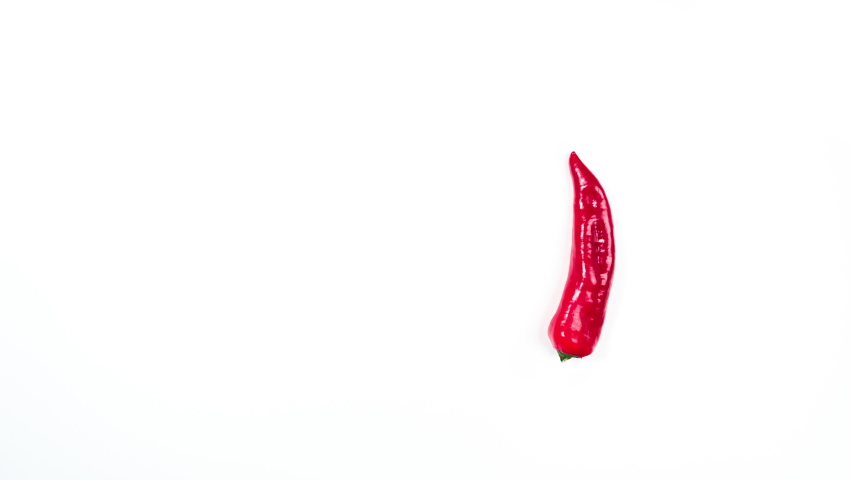4k Load up on healthy vegetables. Red pepper moves in a circle фе looping. Creative stop motion animation. Program load loop. Vegetable healthy nutrition concept. White background.