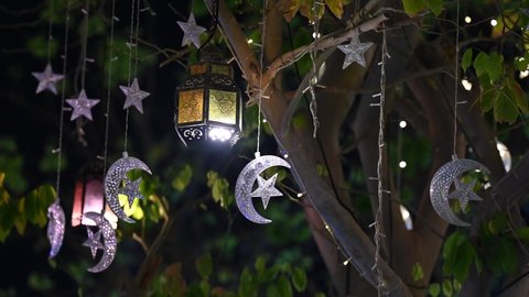 4K: Arabic lantern at night for the Islamic holiday, Ramadan lantern and lights illuminate at night, Ramadan decorations