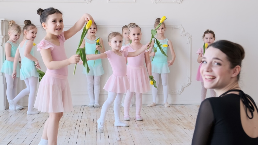 Little girls of the ballerina run to embrace the teacher. | Shutterstock HD Video #1089393113