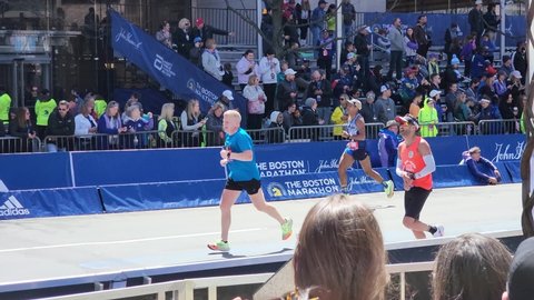 Boston, Massachusetts - April 18, 2022: Boston Marathon Runners Finishing