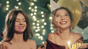 Young woman blowing out fire on candles and making wish at party or celebration. Close-up portrait of smiling asian girl and friends making surprise and taking out birthday cake with candles. - Powered by Shutterstock - Get 15% off with code: PIKWIZARD15
