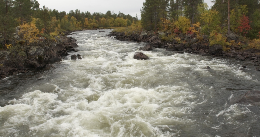 View of Jäniskoski rapids in autumn at Jäniskoski, Inari, Lapland, Finland.