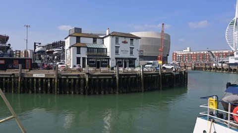 Portsmouth, Hampshire, UK, March 25 2022. The Bridge Tavern at Portsmouth Point with Camber Quay in the foreground.