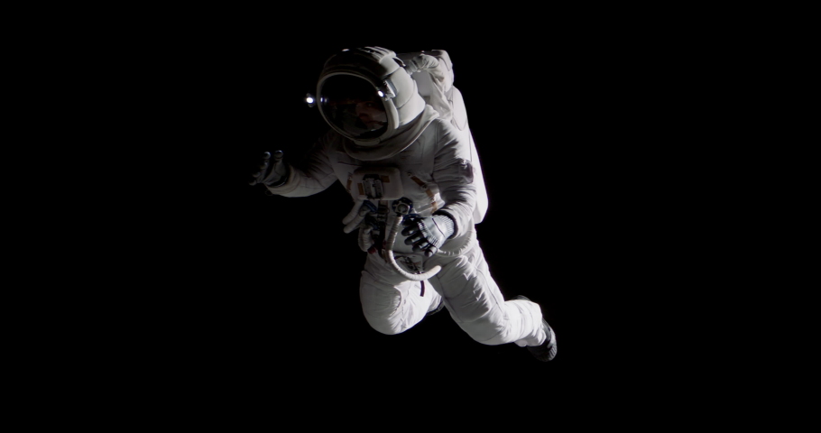 Full portrait of Caucasian female astronaut during spacewalk, black deep space background Royalty-Free Stock Footage #1089399315
