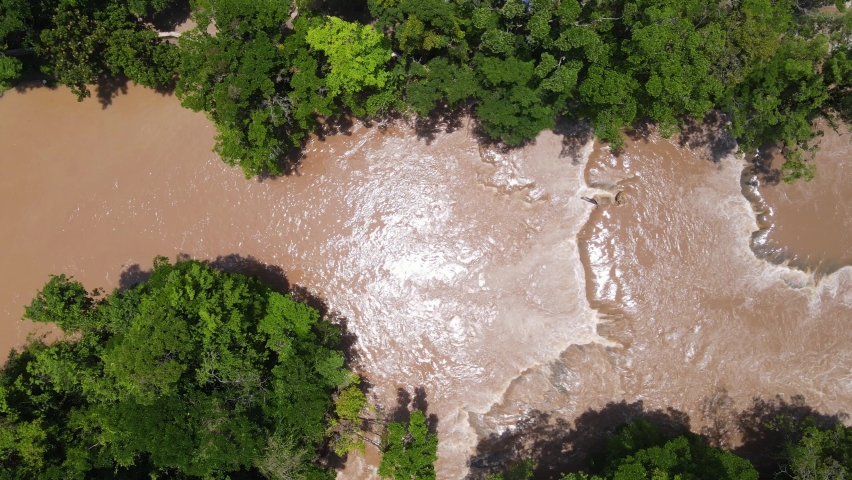 Aerial: swollen river after heavy rainfall, Agua Azul falls Mexico, 4K top down