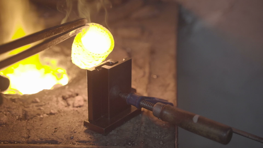 Melting gold. Molted metal pouring into bar.melting gold dripping. Jewelery production. | Shutterstock HD Video #1089406813