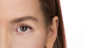 woman eye transforms by eliminating wrinkles. Morphing face.