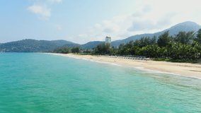 Panoramic aerial scenery sea background. Tropical  golden beach shore. Sandy cost white cloud blue sky. Video 4k copy space 2022.