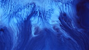 Fluid art drawing video, trendy acryl texture with flowing effect. Liquid paint mixing backdrop with splash and swirl. Detailed background motion with blue and navy blue overflowing colors.