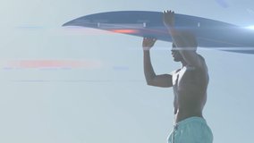 Animation of light over happy african american man carrying surfboard on beach. water sports, active lifestyle and vacations concept digitally generated video.