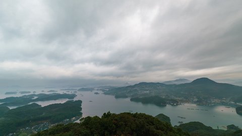Time lapse pan of Kujuku Shima Islands in rain storm in Saikai National Park in Nagasaki Prefecture, Japan