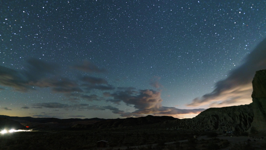 Time lapse night to day transition of Milky Way to sunrise in Mojave desert in California