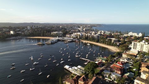 Sydney, Australia - 02-16-2022: Manly Drone Shot over Busy Boats at Sunset
