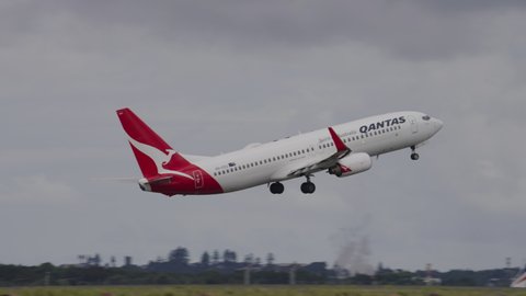 Sydney, Australia - Mar 26, 2022: Qantas airplane climbing after takeoff at Sydney airport