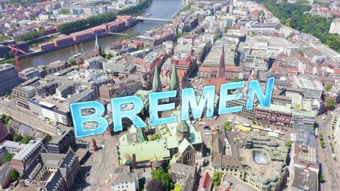 Inscription on video. Bremen, Germany. The historic part of Bremen, the old town. Bremen Cathedral ( St. Petri Dom Bremen ). View in flight. Arises from blue water, Aerial View, Point of interest