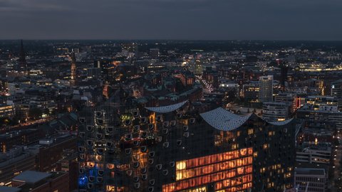 Establishing Aerial View Shot of Hamburg De, Mecklenburg-Western Pomerania, Germany at night evening, view from river, super clear image, marvellous view